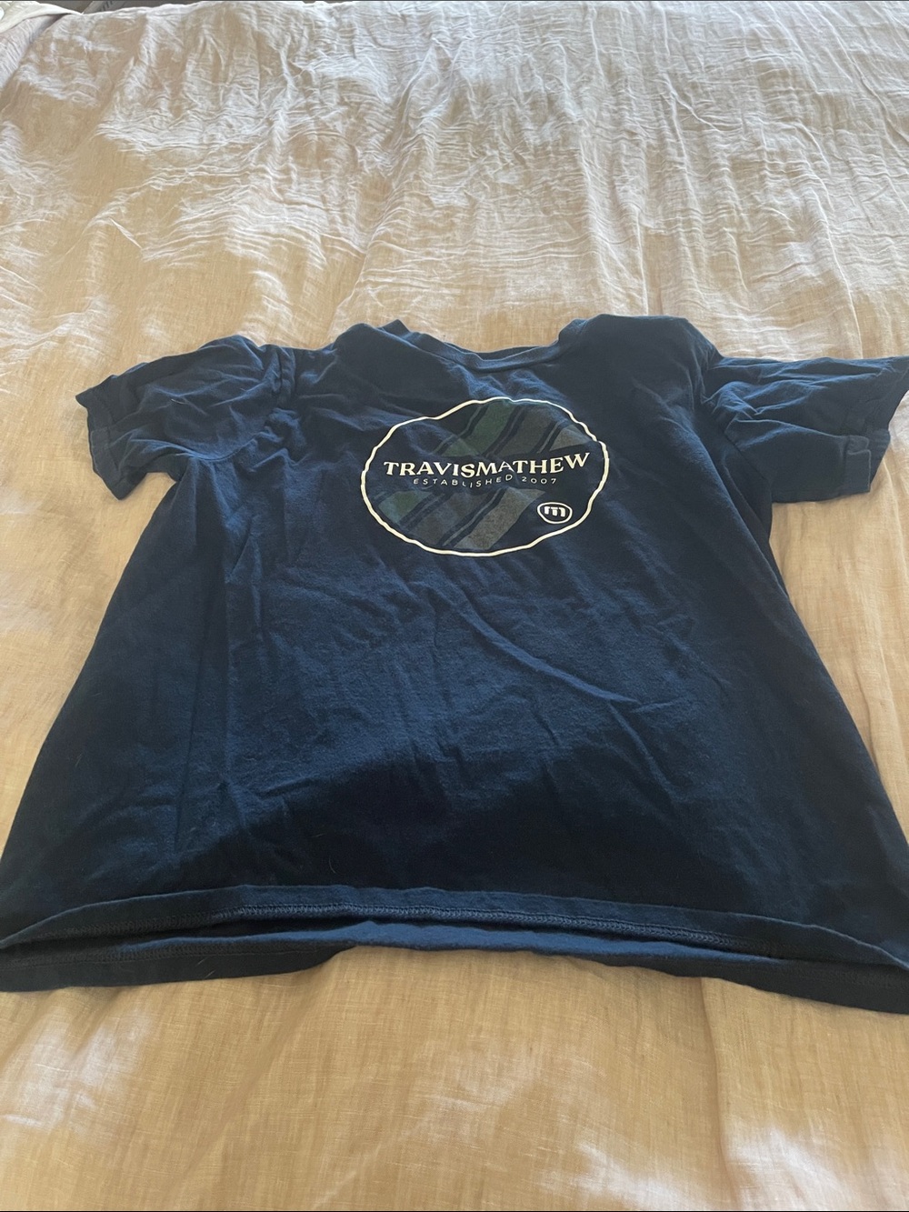 Travis Mathew Kids Navy Short Sleeve Tee with Center Crest